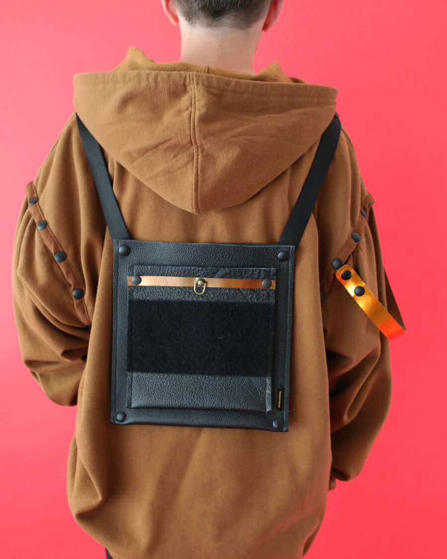 spark rebel features upcycled leather pins belt for the modular hoodie in sustainable fashion