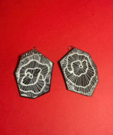 spark and rebel features upcycled black and white flower earrings in eco fashion