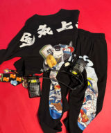 spark and rebel features upcycled preloved track- pants and sweater and belt in street style eco fashion