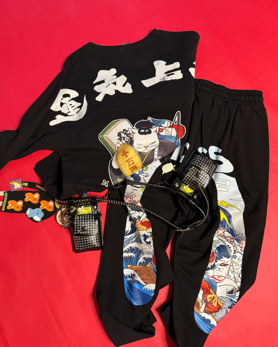 spark and rebel features upcycled preloved track- pants and sweater and belt in street style eco fashion