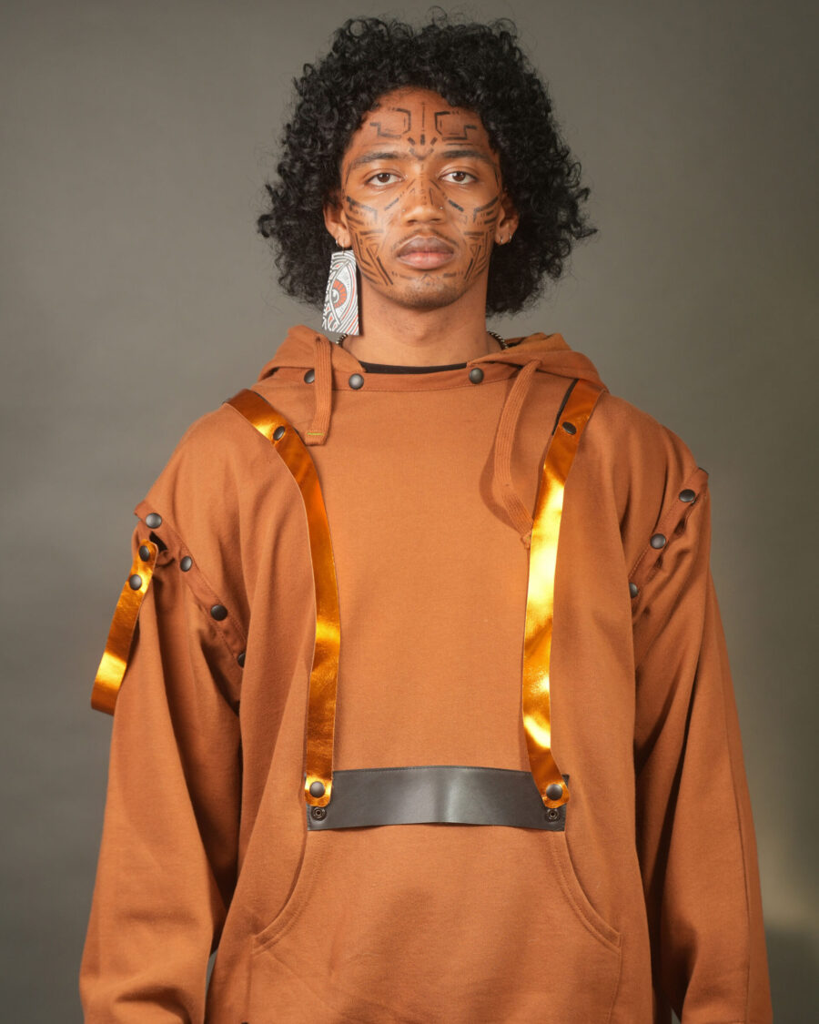 spark and rebel features upcycled leather pins for the modular hoodie in sustainable fashion