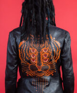 spark and rebel features upcycled leather unique tiger print jacket in eco fashion