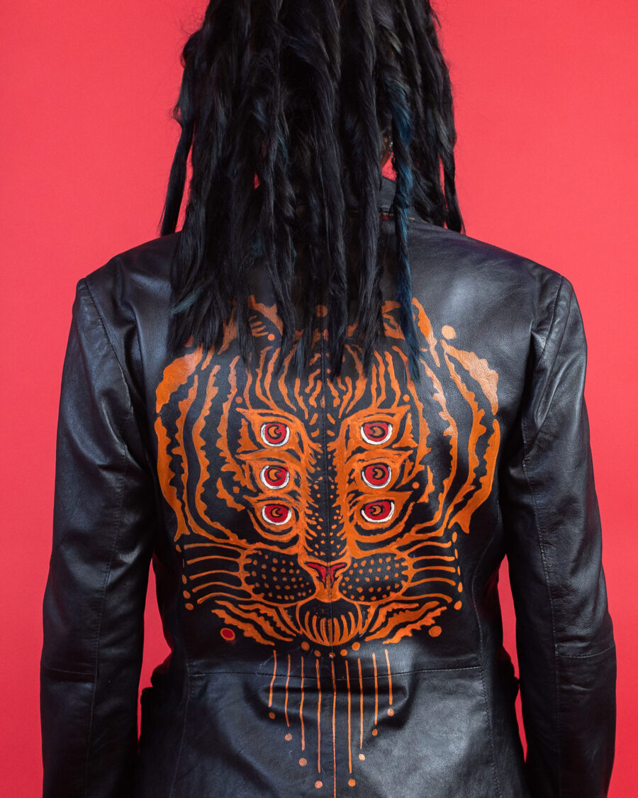 spark and rebel features upcycled leather unique tiger print jacket in eco fashion